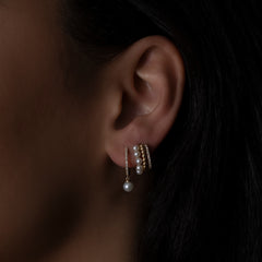 Pearl and Pave Diamond Triple Gold Huggies with dangle design.