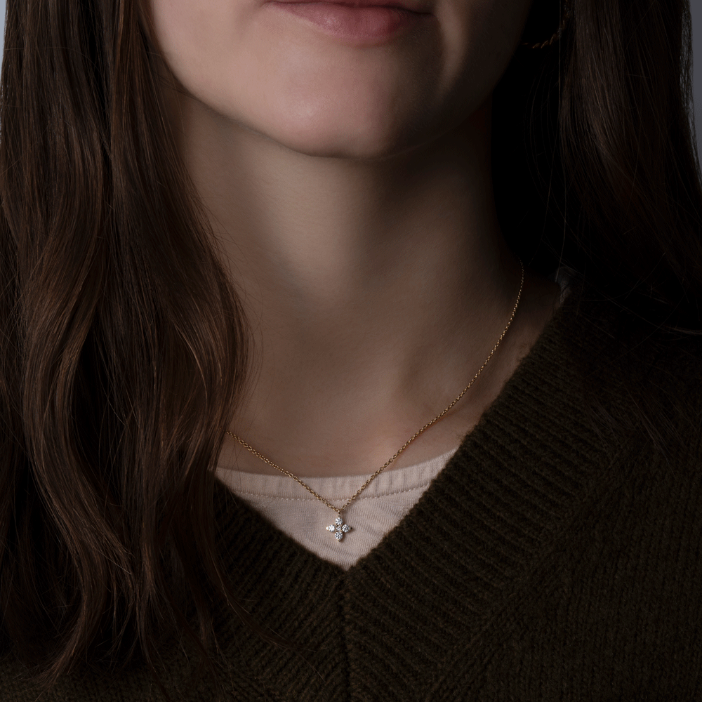 14k yellow gold diamond starflower necklace worn on model