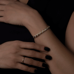 14k yellow gold double twist diamond bangle on model