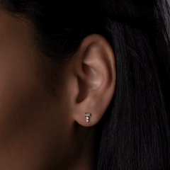 14k yellow gold baguette and round diamond cluster stud earrings on model