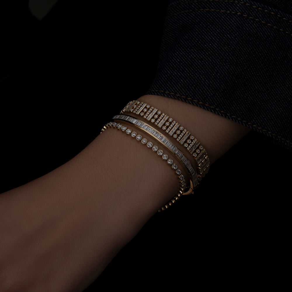 14k yellow gold diamond bracelet stack on model with baguette and round diamonds