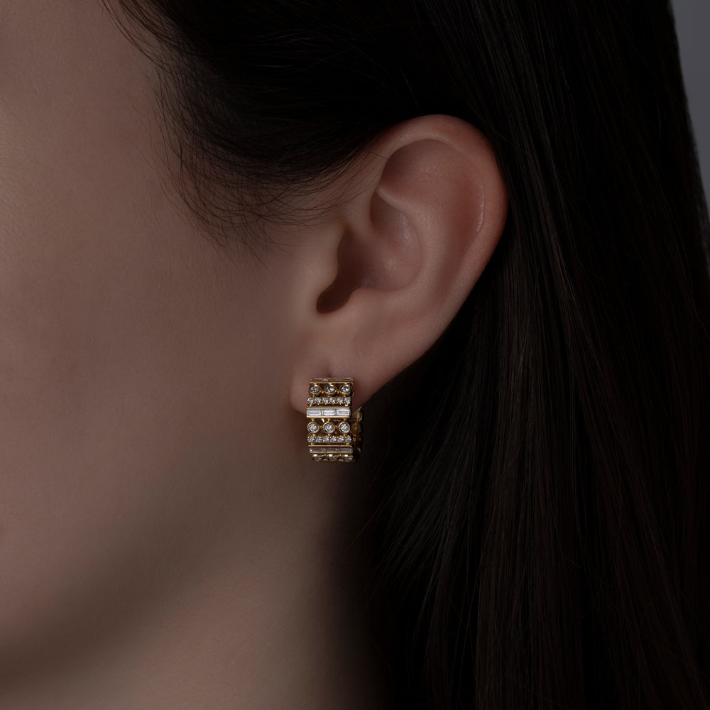 14k yellow gold multi setting diamond earrings on model