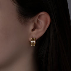 14k yellow gold multi setting diamond earrings on model